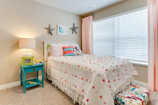 On the opposite side of upstairs from the primary are 2 more generous bedrooms. *Photos of model home, finishes and options will vary.