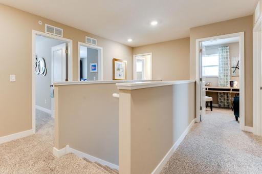 The upstairs is open and configured to give the primary bedroom a little extra privacy. *Photos of model home, finishes and options will vary.
