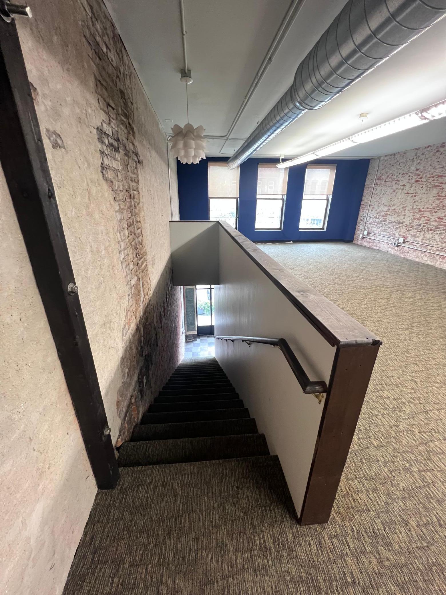 Stairs leading up to second floor space.