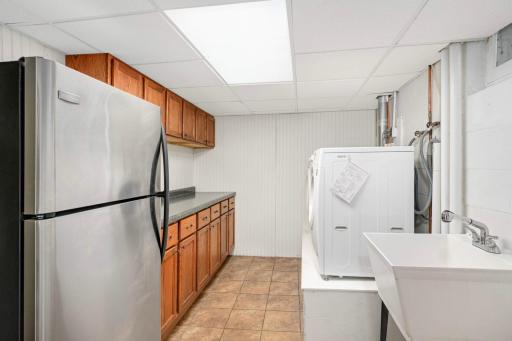 Additional storage and extra fridge in laundry room