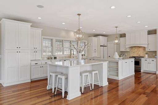 A true Chef's Kitchen! Enjoy enameled custom cabinetry with soft-close door and drawers and cabinets with roll-out shelving.