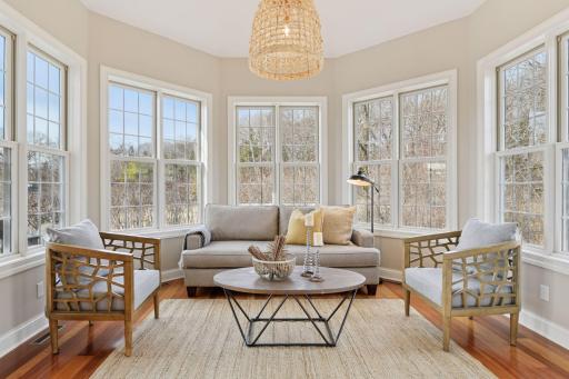 Sit back with your morning coffee or unwind at the end of the day in the vaulted Sun Room. This space has been updated with a new designer light fixture.