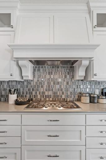 Everyone loves a gas cooktop complete with overhead fan.