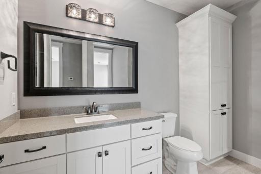 Bathroom attached to fifth bedroom with lots of cabinet space.