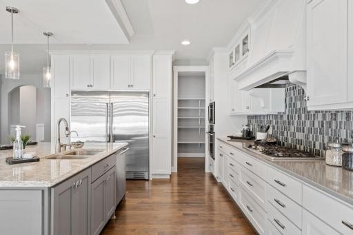 The kitchen has all stainless steel Electrolux appliances.