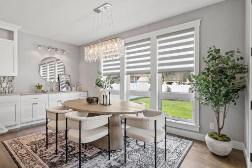 The dining room with a gorgeous, custom light fixture.