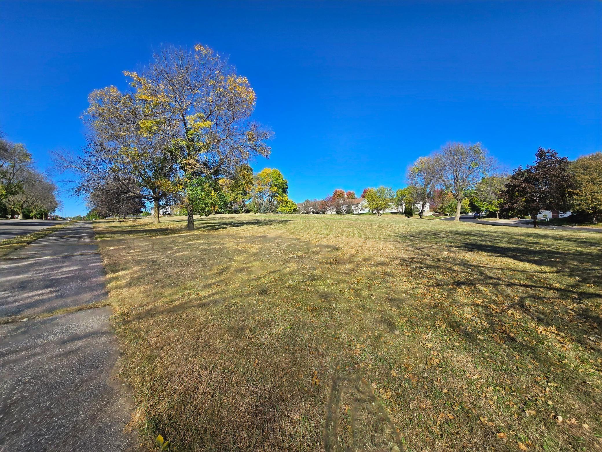 Southern property line along 4th Street. Walking path leads to high school