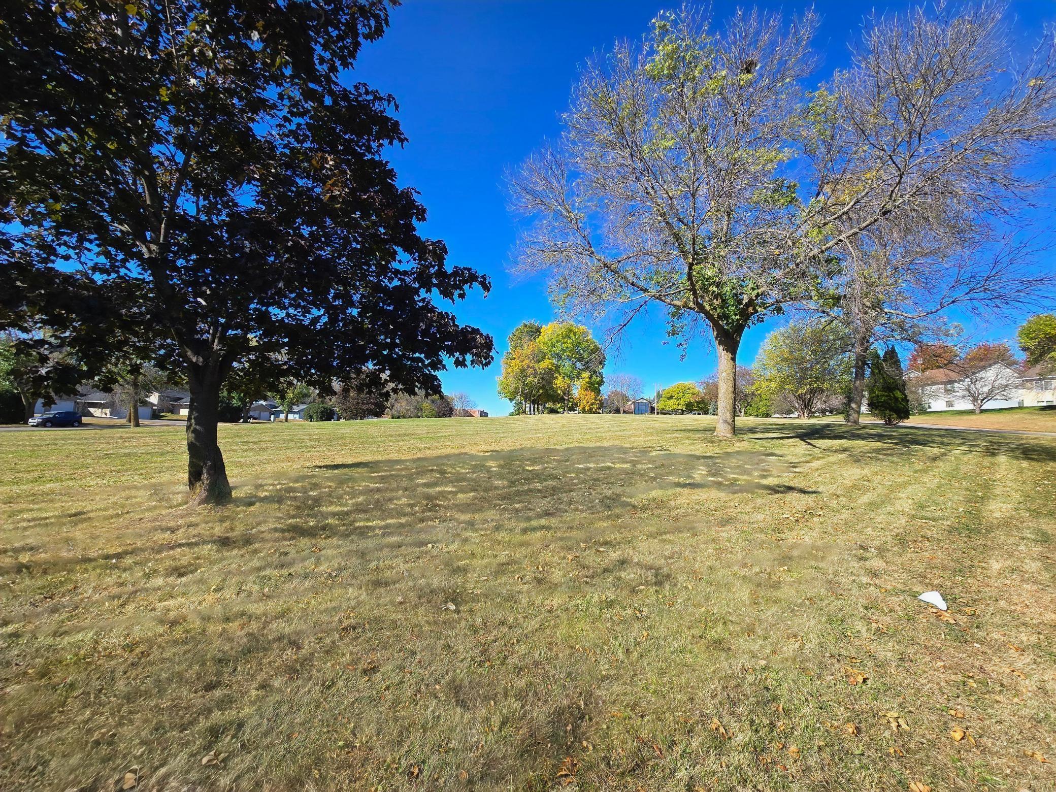 Standing on NE corner of property line facing south west. Church up on the right
