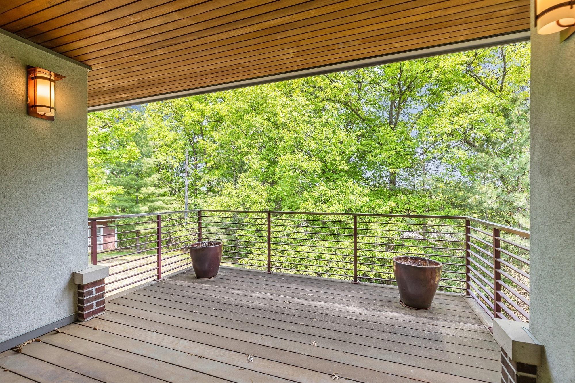 Balcony overlooking backyard off of front foyer