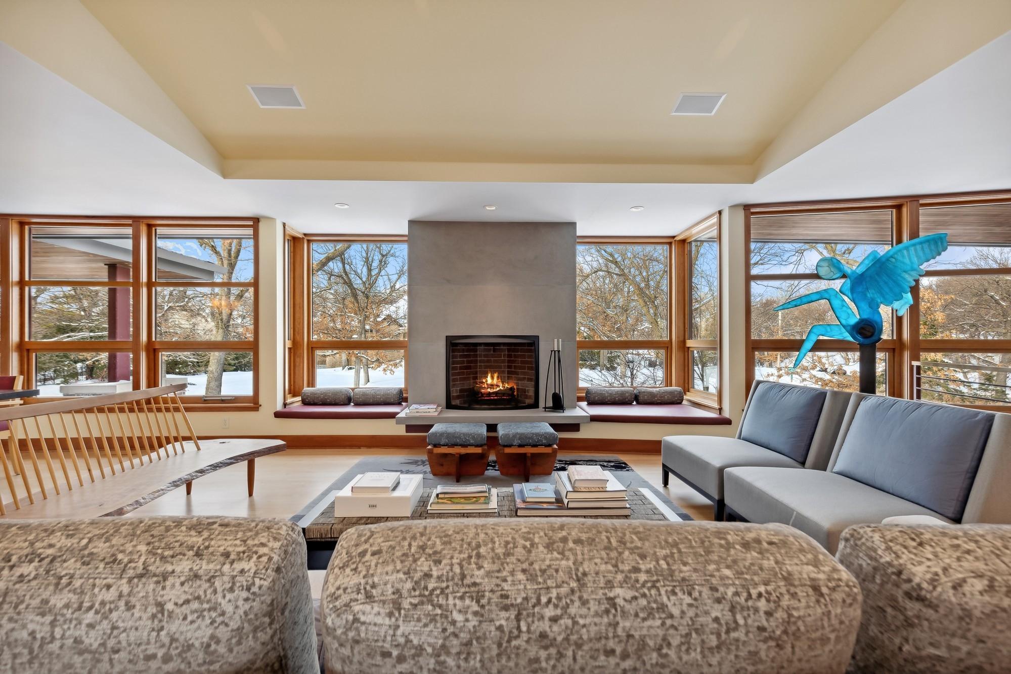 Attractive Dyed Indiana Limestone Masonry Fireplace. H Windows and Doors Throughout Home.