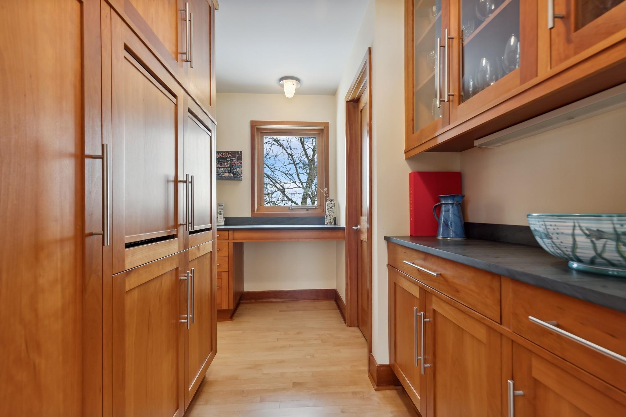 Cherrywood Butler's Pantry has Abundant Storage and Slate Counters