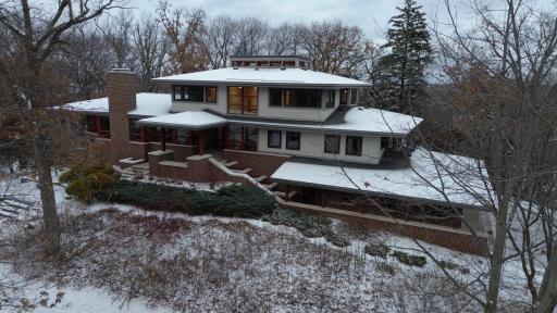 Custom Architecture with Low Maintenance Exterior Brick, Stucco, Limestone, Metal, Concrete and Clear Cedar Eaves