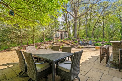 Main patio is organic in shape and is a true extension of living space
