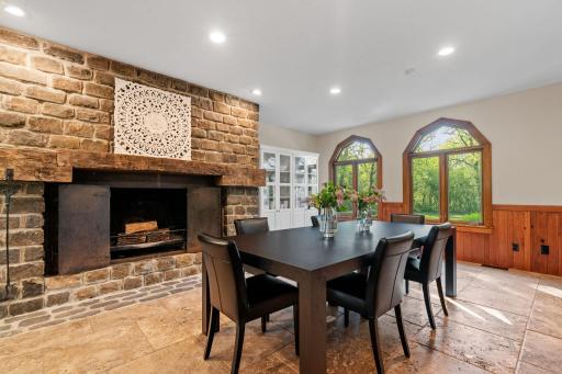 Hickory paneled wainscoting and travertine stone tile flooring in the Dining Room