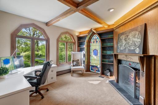 Office has French doors with reeded glass and transom window