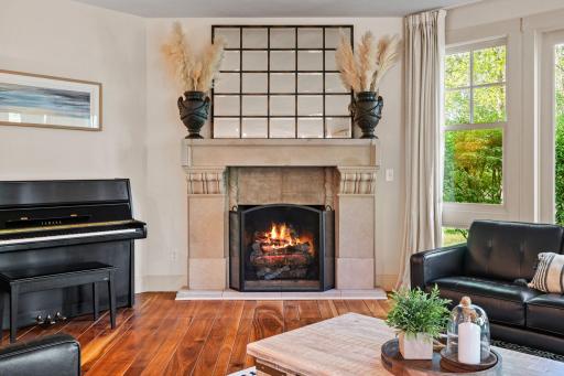 Corner wood burning fireplace with limestone surround