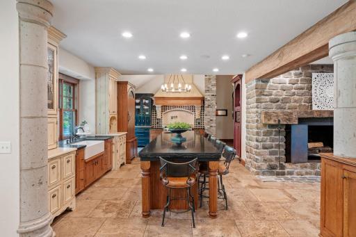 Features include toaster drawer with power, appliance garage, roll-out storage, pantry with creative storage and venetian glass doors