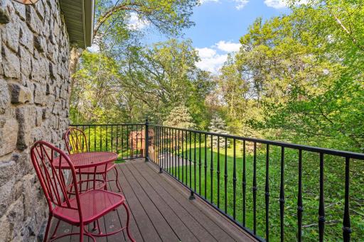 Full glass entry door with access to private balcony - balconies feature maintenance free decking and metal railings and offer tree-top views of the stunning property