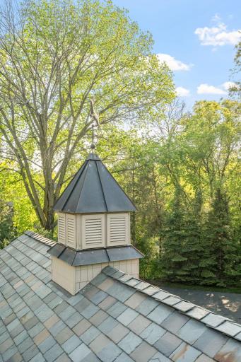 Weathervane w/ copper roof accent the slate tiles
