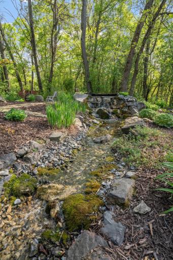 Waterfall feature tucked perfectly in this thoughtful landscape