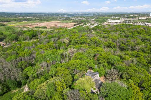 Land offers natural wooded areas, pond and expansive green spaces for play