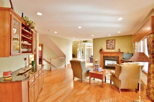 Looking back at sitting room & two sided gas fireplace from kitchen area.