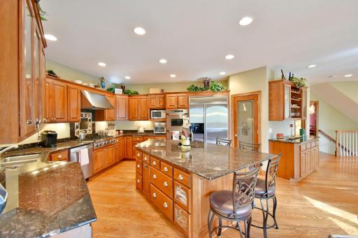 Large walk in pantry, open concept, large kitchen space with giant granite island, informal eat in kitchen. Commercial grade stainless steel appliances, 6 burner gas stove, double oven, fan/hood exhaust