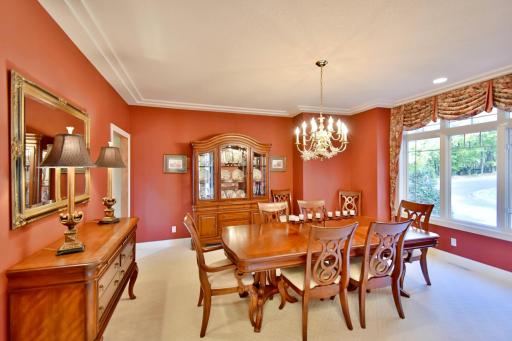 Formal dining area off of front entry overlooking stately front circle driveway, roasted red pepper decor, racetrack ceiling, wonderful space for entertaining & holiday gatherings!