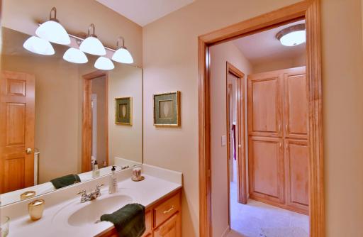 Pass through Jack & Jill bathroom between upstairs bedrooms, solid surface counter & walk in shower.