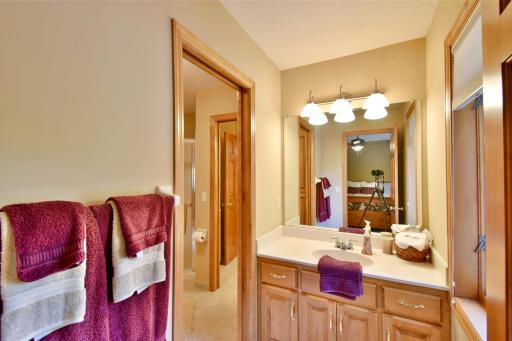 Pass through Jack & Jill bathroom between upstairs bedrooms, solid surface counter & walk in shower.