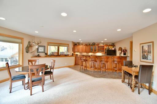 Walkout basement views, wet bar & game room area, neighboring kitchenette room and mechanical room.