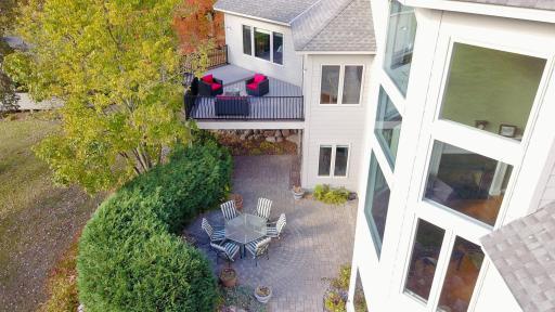 Aerial drone shot of new maintenance free deck and private lower level paver patio.