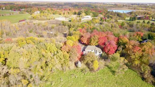 Aerial drone view of back of home (5.86 acres)