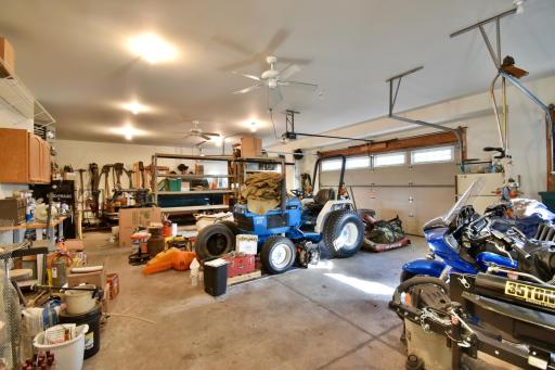 Finished, heated & insulated 4 car garage with finished hang out, man cave spaces upstairs.