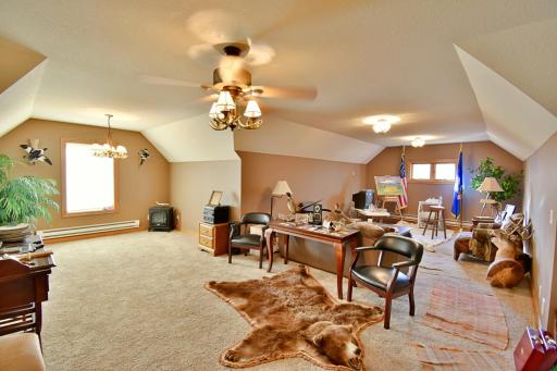 Upstairs spaces over detached 4 car garage, electric baseboard heat.
