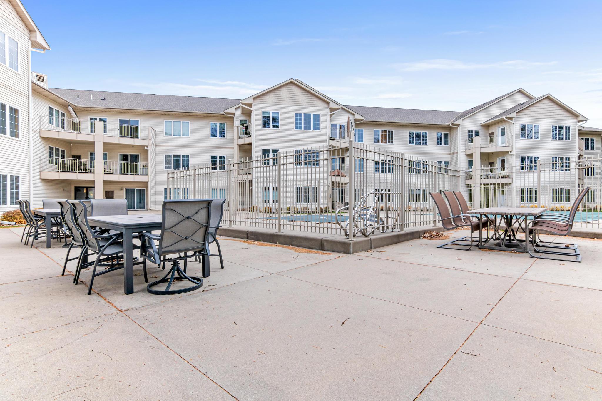 Patio by pool and hot tub