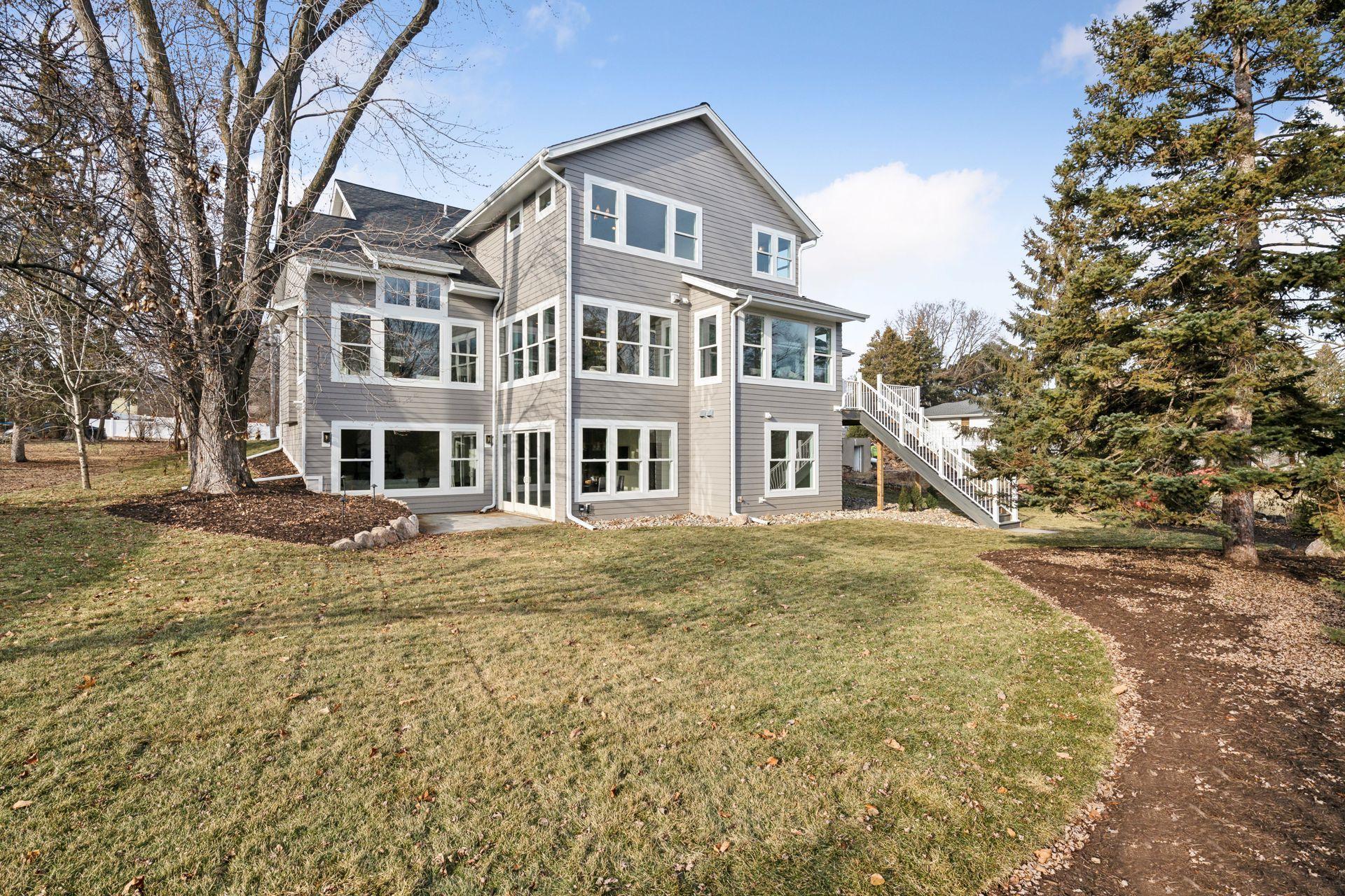 Back of home with a walk-out lot