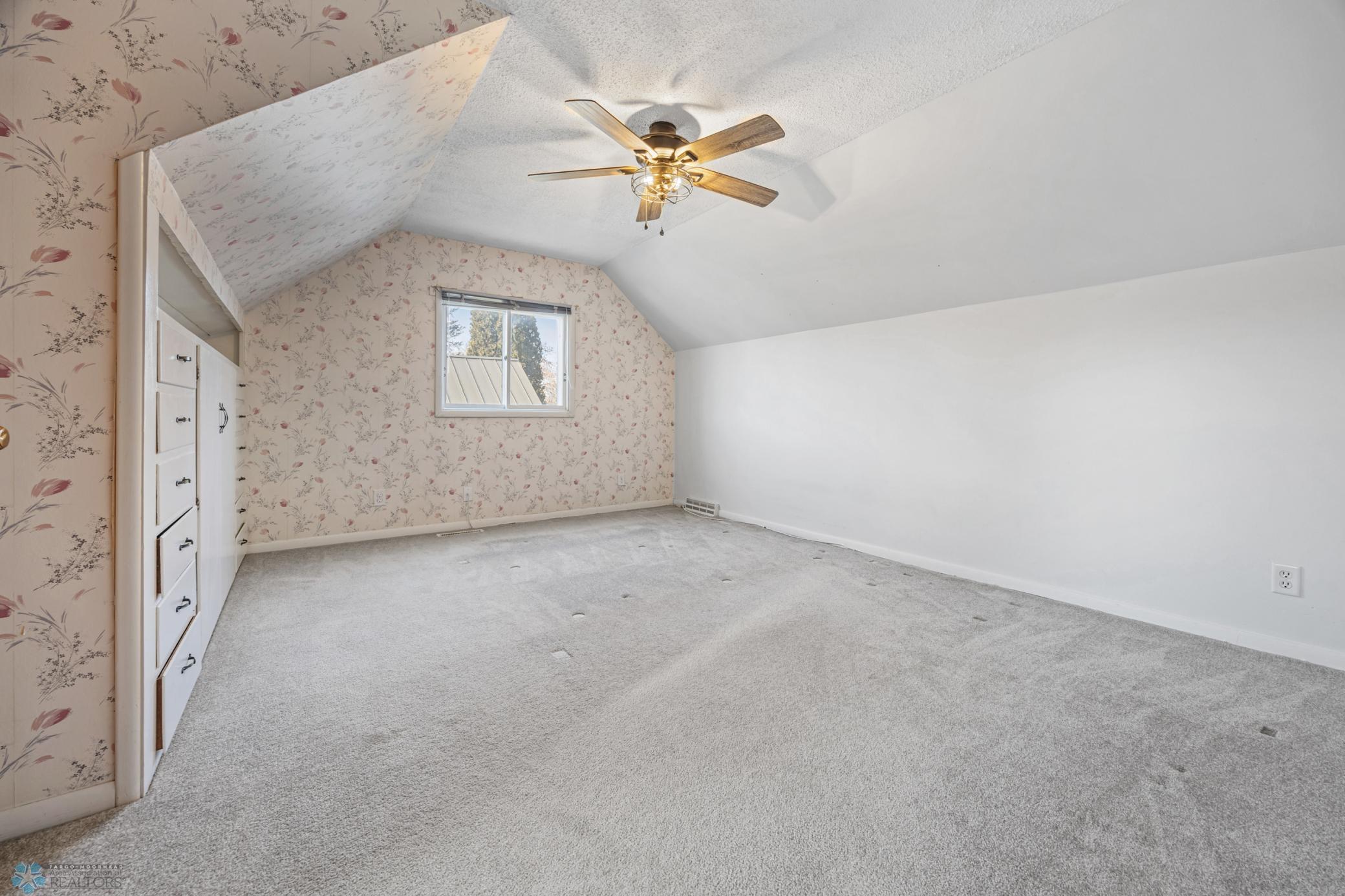 Upstairs primary bedroom. Built-ins and large walk-in closet.