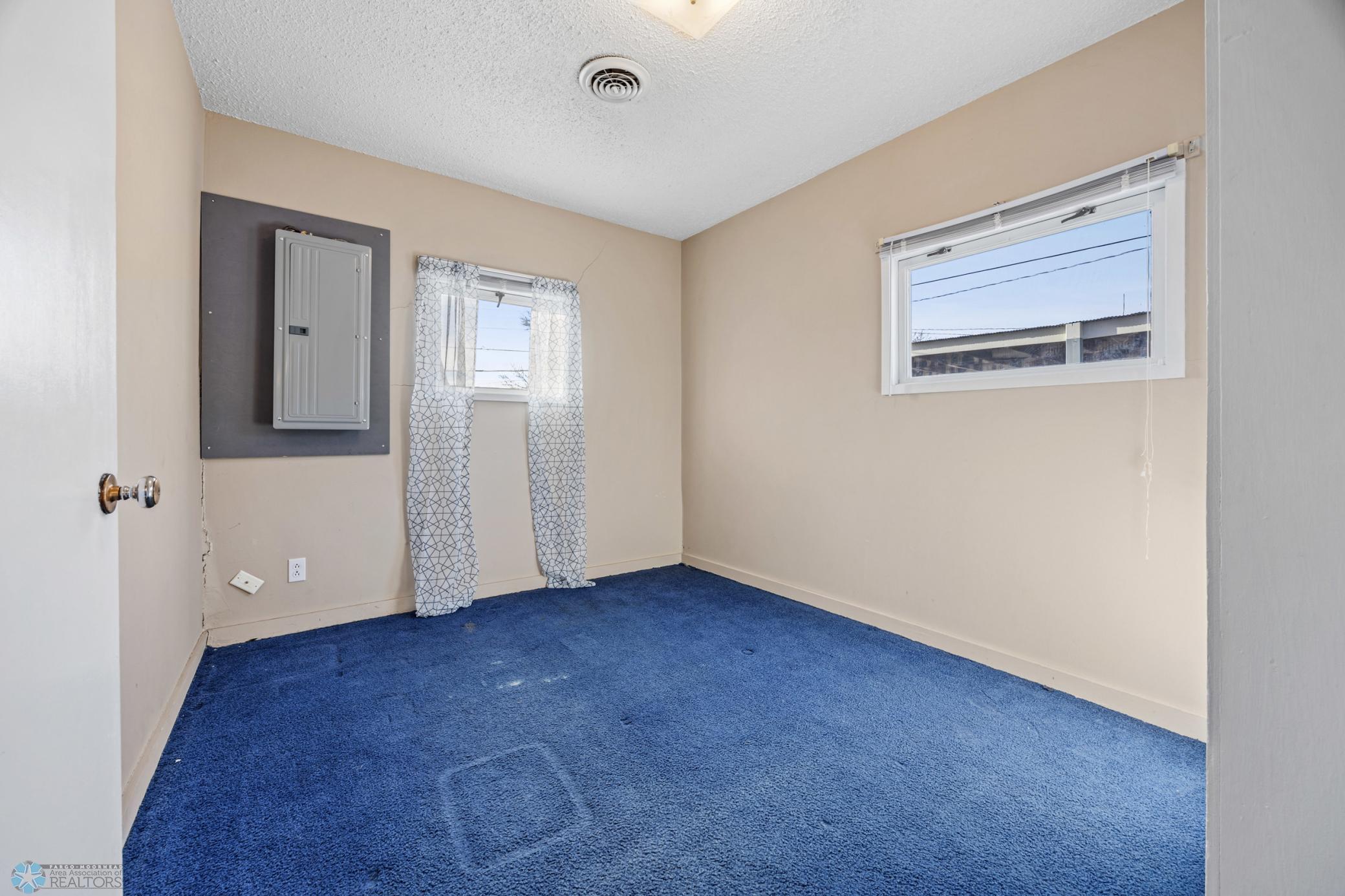 Bedroom 2. Electric panel recently updated and replaced.
