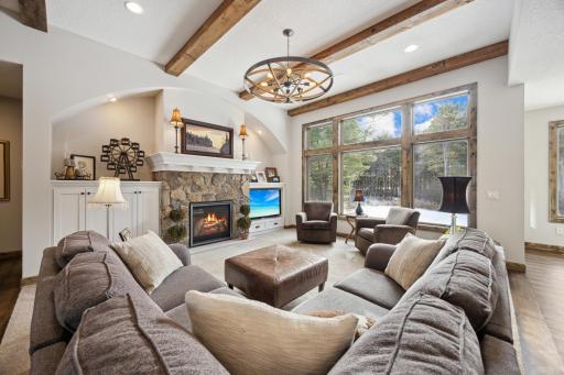 Floor to ceiling windows with private views with large yard that has irrigation system.