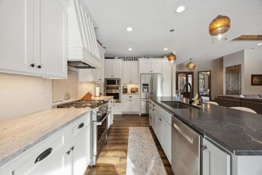 Great gas range with an additional wall oven and microwave make this a great space for preparing meals everyday or for larger gatherings.