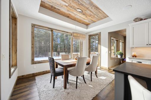 Dining area is a bright spot with southern exposure and leads to maintenance free deck.