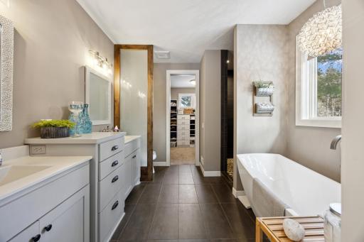Primary ensuite bath has separate tub and walk-in shower with 2 sinks.