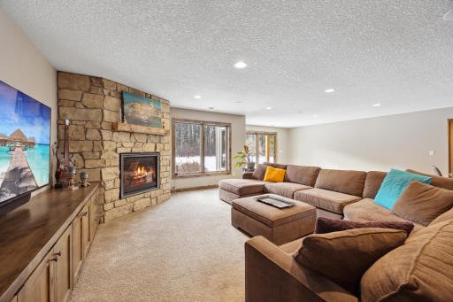Built-ins, nice recessed lighting and a cozy fireplace is fantastic spot for movie nights!