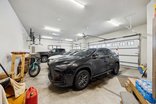 Heated finished 3 car garage with rear door to access the back yard.