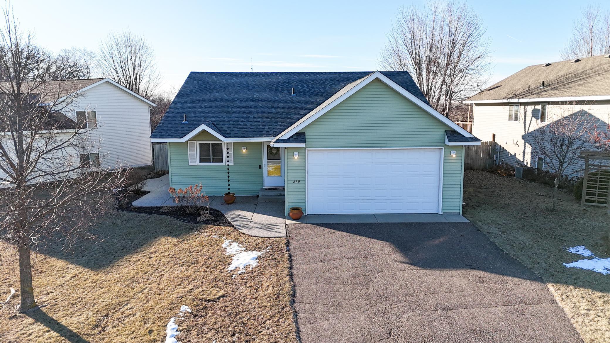 The home’s clean curb appeal is complemented by its inviting front entryway, equipped with a Ring doorbell for added security.