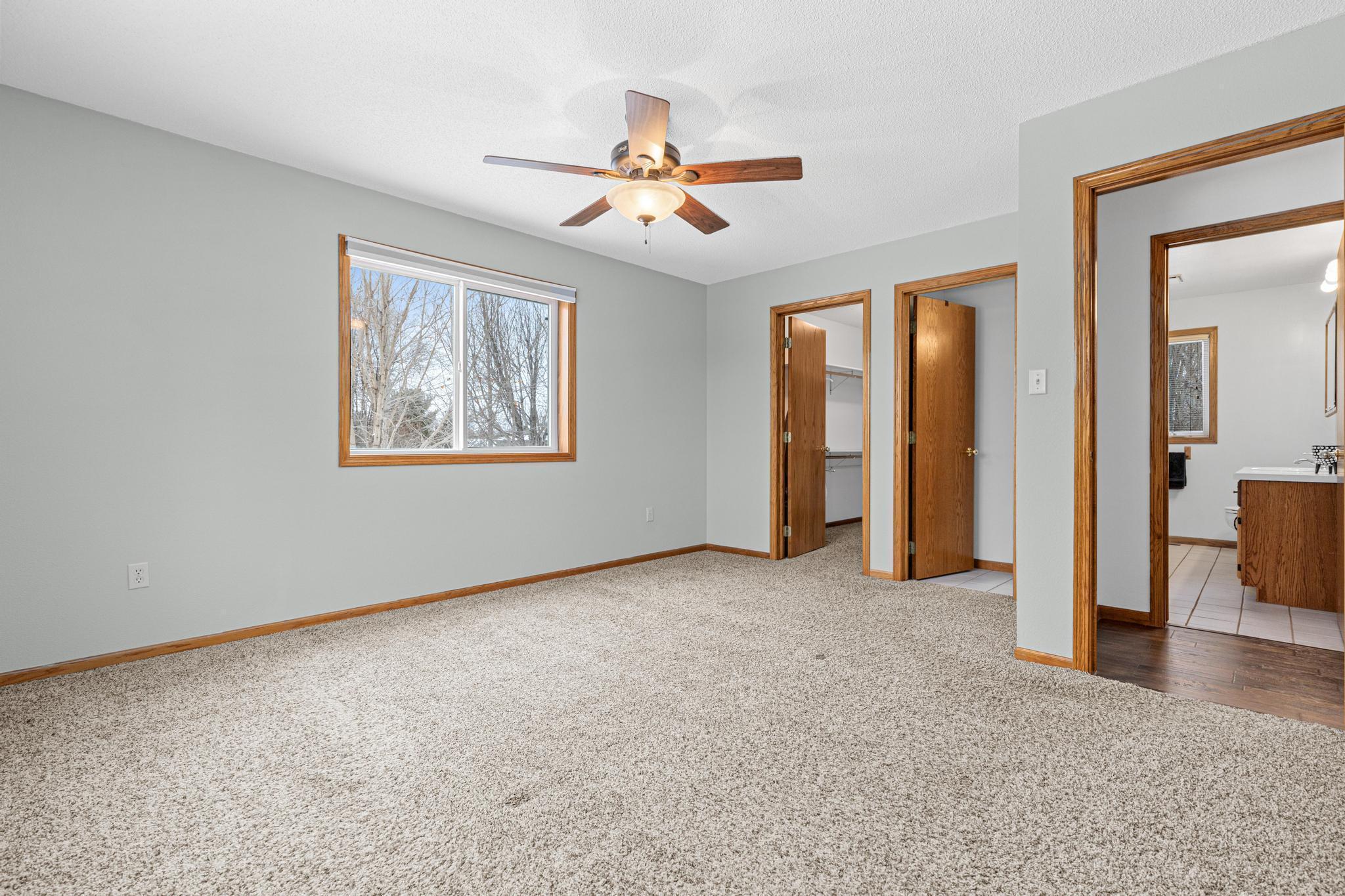 Primary bedroom, with closet, and pass through to bathroom.