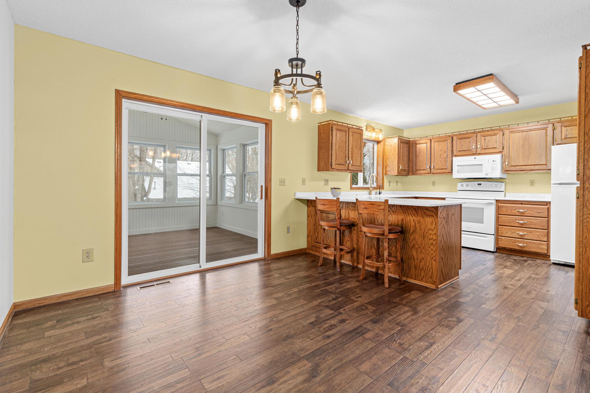 Kitchen to dining room, with access to three season porch