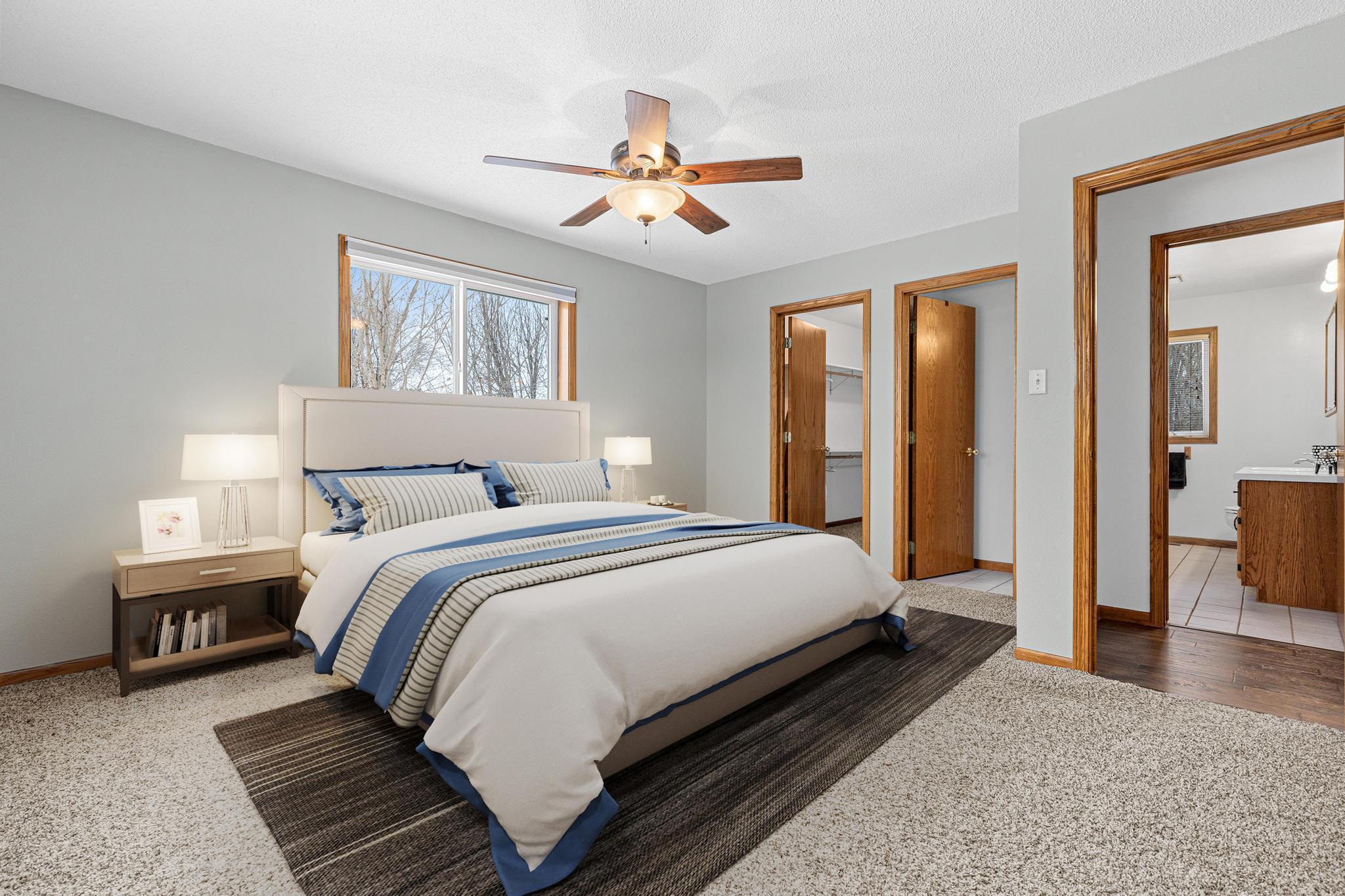 Digital staging of primary bedroom upstairs.