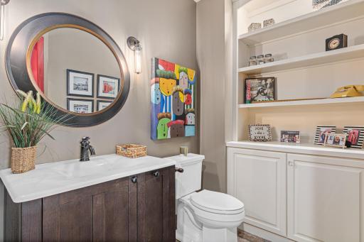 Charming phone booth bathroom—perfectly sized for guests and lake visitors, offering a unique and functional touch.